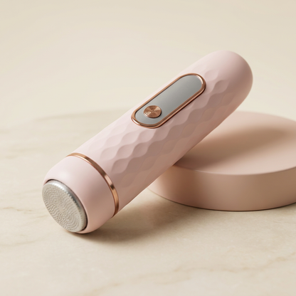 Pink electric callus remover product ad